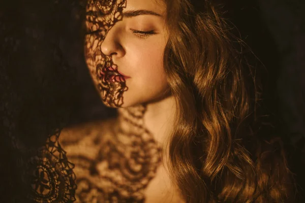 Lace and shadows. Sensual sexy portrait of a young woman. Beautiful long hair. — Stock Photo, Image