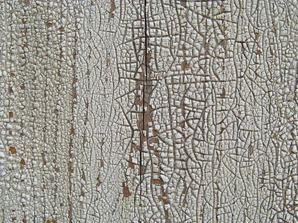 Old and peeled creaky paint , In course of time the paint of white tone peeled off the old planks and crackled, wood texture, background, colorful, cracks in the paint, vintage, abstract, grunge, — Stock Photo, Image
