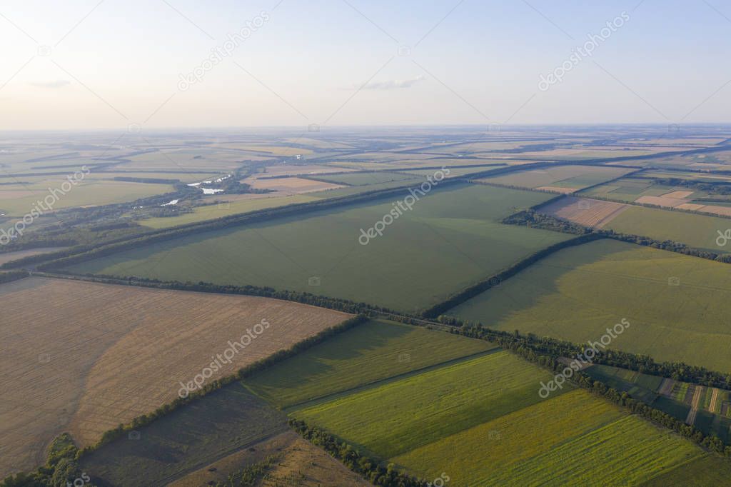 Geometric figures in the fields of the farm in the village from the height of the bird's eye. Kvadrokopter pictures