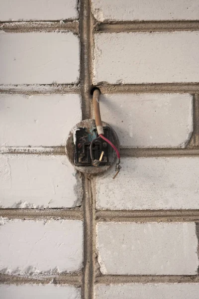Texture of Brick Concrete Wall With Outlet Plug — Stock Photo, Image