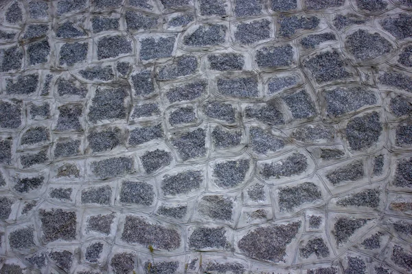 Mauer aus Stein, Zaun. die Struktur des eingezäunten Zauns. — Stockfoto