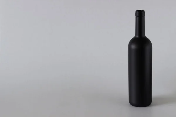 Wine bottle black on a white background — Stock Photo, Image