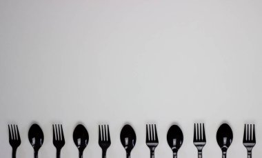 Forks and spoons on a white background. Minimal concept. Without plastic. clipart