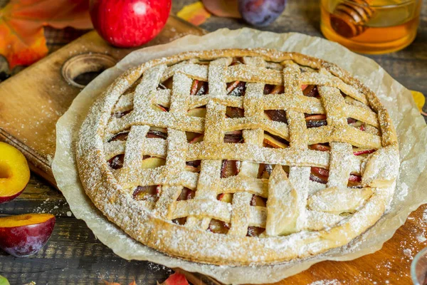 Plum apple pie. Cooking. Recipes. Vegetarian food.