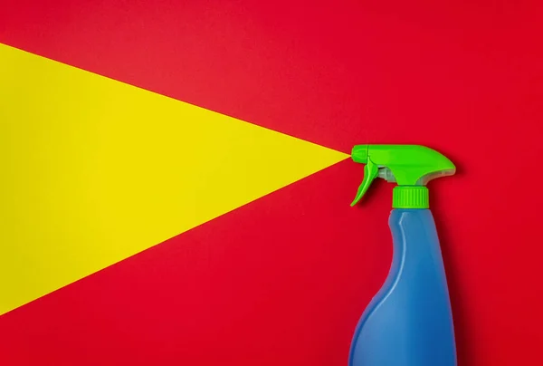 Cleaning agent on a red yellow background. Cleaning. Minimal concept. Copy space