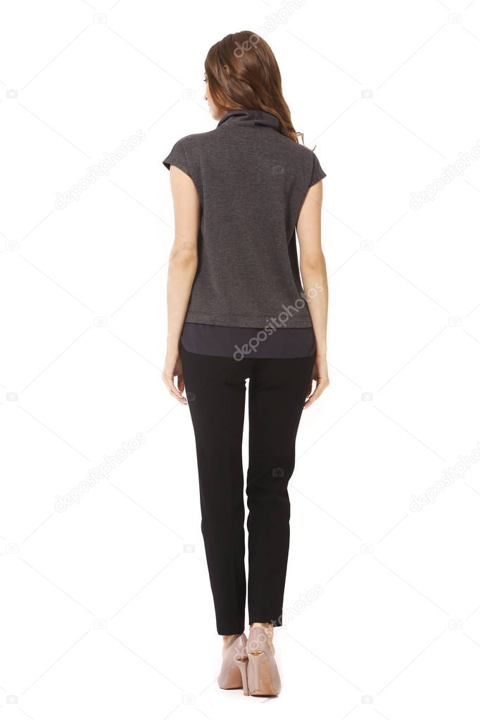 young caucasian business woman executive posing in summer casual print blouse and jeans high heels stiletto shoes full body length isolated on white back view