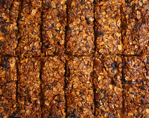 vegan dessert home made muesli bar made with cereals, dried plum and apricot, honey and bran