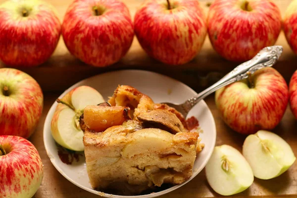 pieces of fresh baked apple pie among raw apples country style s