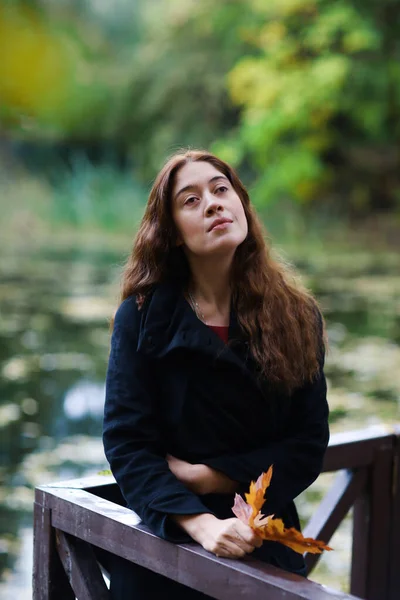 Romantic fall outdoor retro vintage portrait of woman with leafs — Stock Photo, Image