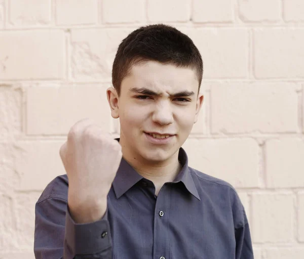Happy Teenager Boy Grimace Show Fist Close Portrait White Wall — Stock Photo, Image