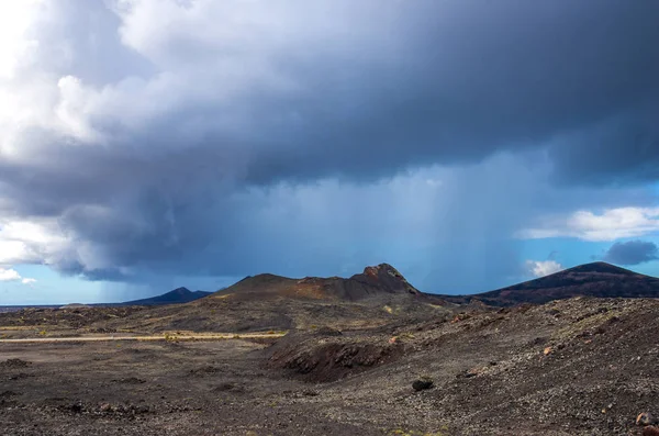 Landscape of a storm over the volcanoes of Timanfaya