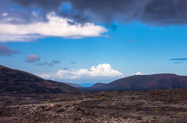 Landscape of a storm over the volcanoes of Timanfaya — Stock Photo, Image