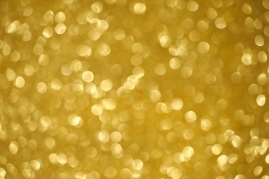 Soyut, bulanık, sarı çelenklerin ışıklarının Bokeh 'i.