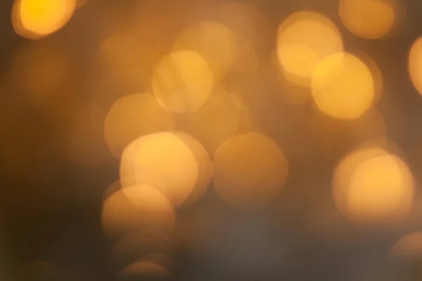 Blurred golden sparkling festive bokeh background — Stock Photo, Image