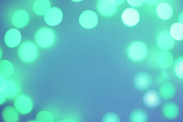 Blurred green and blue sparkling festive bokeh background — Stock Photo, Image
