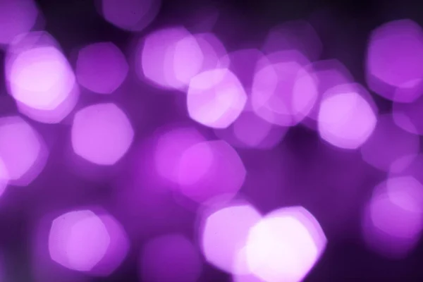 Blurred purple sparkling festive bokeh background — Stock Photo, Image