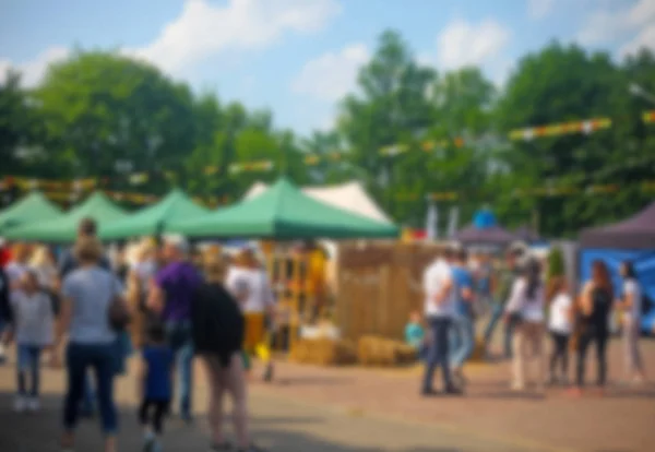 Defocused background of people in park food festival, summer festival — Stock Photo, Image