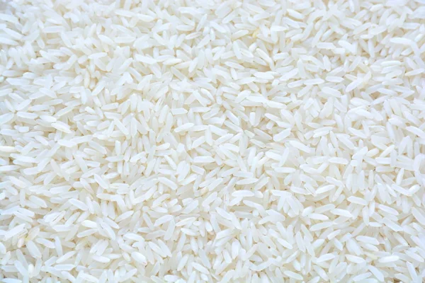 Basmati white rice solid texture. Top view close-up on raw rice grains. Healthy food concept