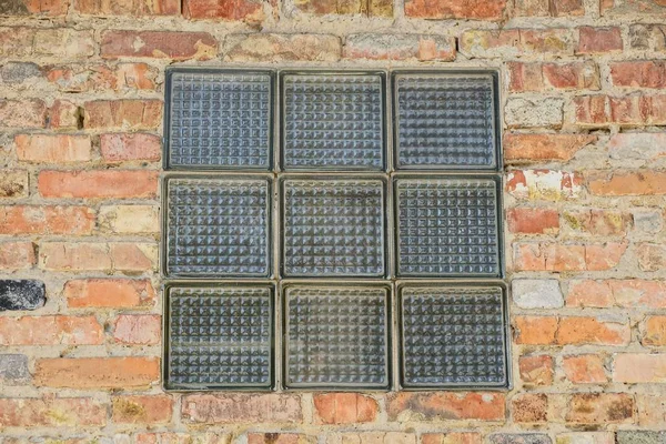 texture of a square glass on a brick wall