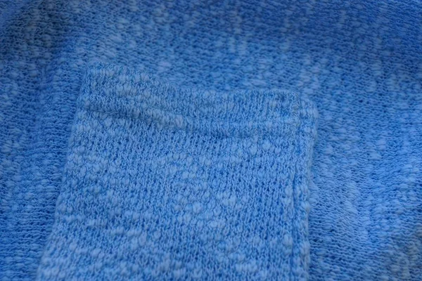 毛衣上羊毛袖子的蓝色织物质地 — 图库照片