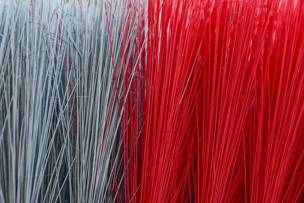 Red gray texture of long bristles on the brush