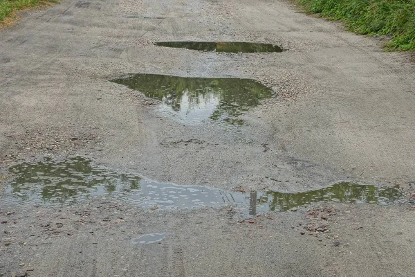 Unasphaltierte Landstraße Pfützen Und Gruben — Stockfoto