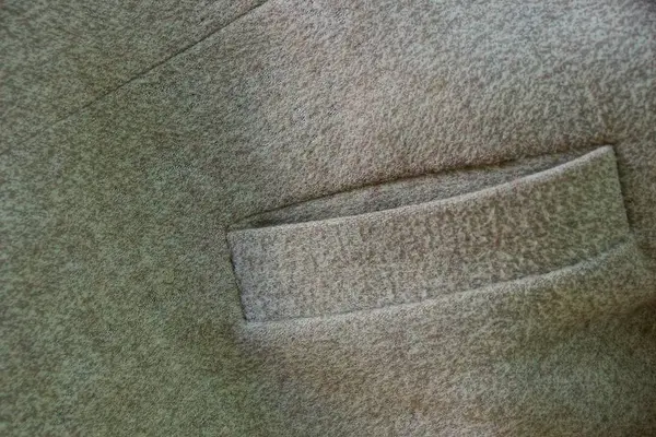 Grau Braune Textur Mit Einer Leeren Tasche Auf Der Kleidung — Stockfoto