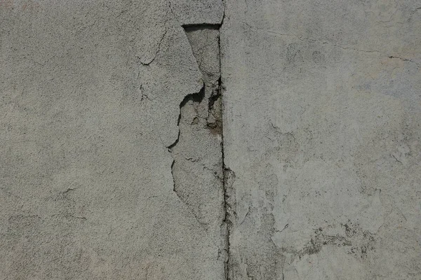 Graue Steinstruktur Aus Einer Schmutzigen Betonwand Mit Einem Riss — Stockfoto