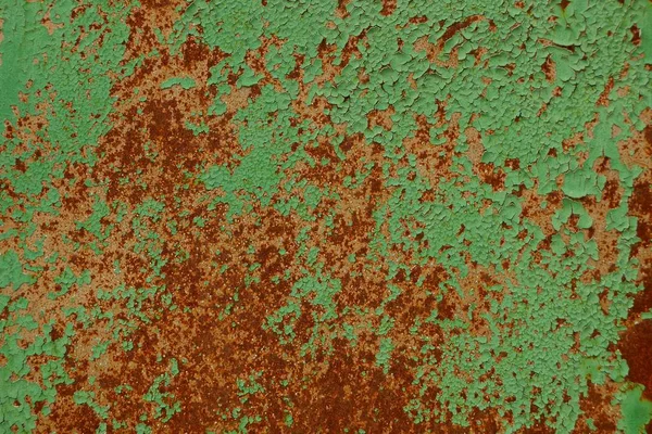 colored metal texture from a green rusty wall