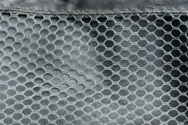 gray fabric texture of fine mesh on crumpled matter