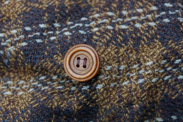 Hnědá Textura Kusu Oblečení Tlačítkem — Stock fotografie