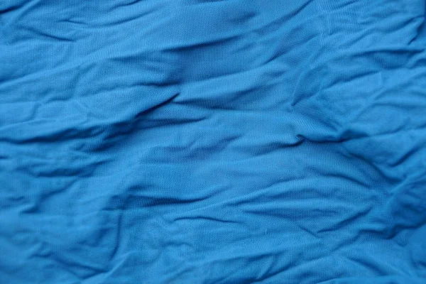 Blauwe Textuur Van Verfrommeld Doek Uit Een Stuk Van Kleding — Stockfoto