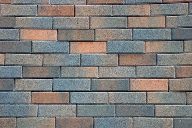 Kahverengi taş arka plan bir tuğla duvar parçası