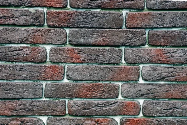 れんが造りの壁の片から茶色の石の背景 — ストック写真