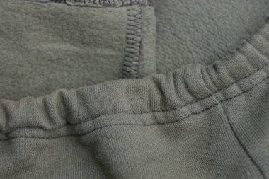 gri yeşil arka plan kumaştan giysi buruşuk bir parçası