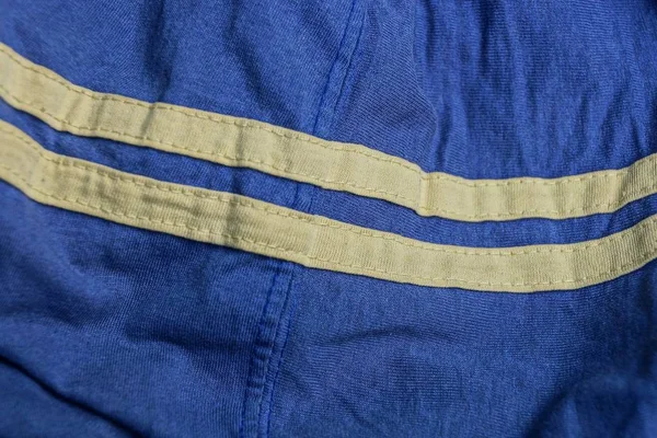 Textura Tela Azul Ropa Arrugada Con Dos Rayas Amarillas —  Fotos de Stock
