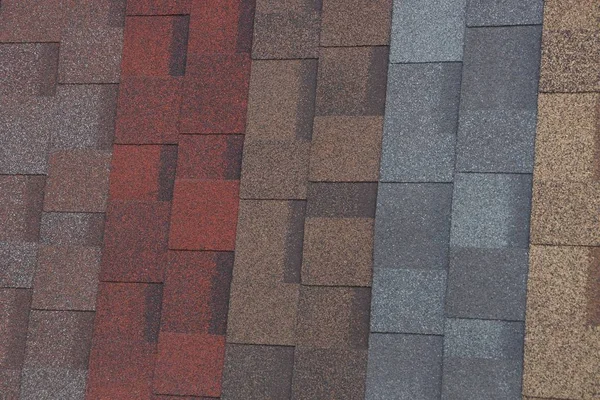 colored background of tiles on the roof of the house
