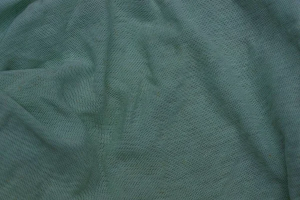 くしゃくしゃになった布の緑色の明るい質感 — ストック写真