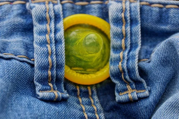 Yellow Condom Pocket Blue Trousers — Stock Photo, Image