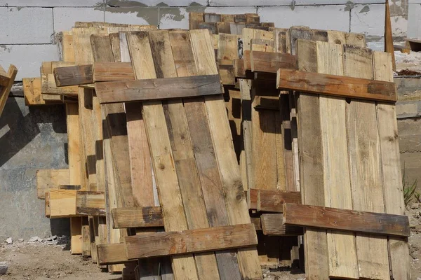 Pile Brown Pallets Wooden Planks Wall — Stock Photo, Image