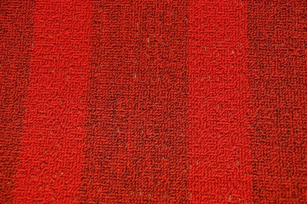 red woolen texture from a piece of carpet