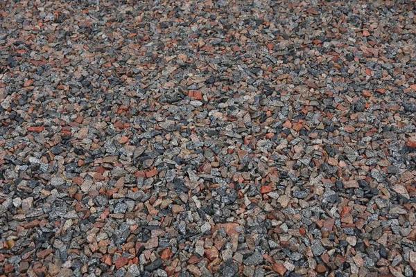 stone texture of fine wet rubble in a heap