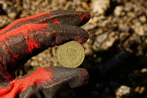 Copper old coin in hand