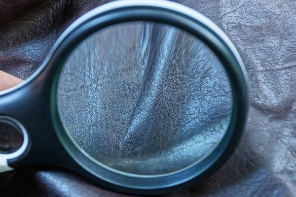 Black Magnifier Increases Brown Crumpled Skin Clothes — Stock Photo, Image