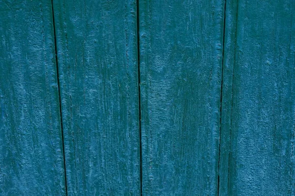 Green texture of the boards on the wall of the house
