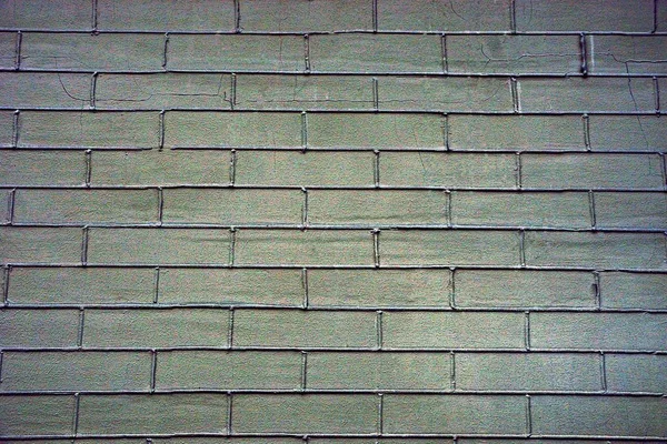亀裂を持つレンガの壁の灰色の緑色のテクスチャ — ストック写真