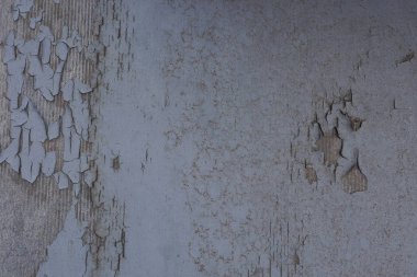 ovuşturulmuş boya ve çatlaklar ile eski bir duvardan gri arka plan