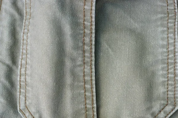 縫い目を持つ綿の衣服の灰色の生地の背景 — ストック写真
