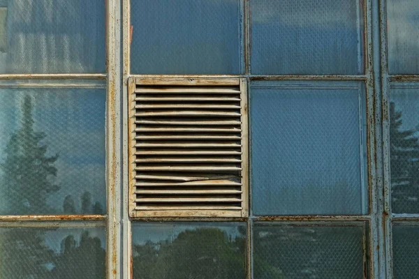 texture  a row of old square windows and iron bars