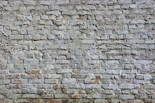 The gray wall of a private house made of bricks